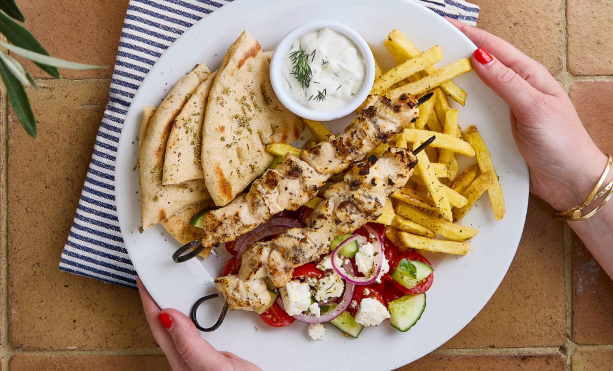 Chicken souvlaki with chips, Greek salad, Tzatziki and flatbread